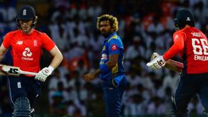 England cricket captain Eoin Morgan (L) and Joe Root (R) runs between the wickets as Sri Lankan cricketer Lasith Malinga (C) look on during the fourth one day international (ODI).(AFP) England cricket captain Eoin Morgan (L) and Joe Root (R) runs between the wickets as Sri Lankan cricketer Lasith Malinga (C) look on during the fourth one day international (ODI).(AFP)