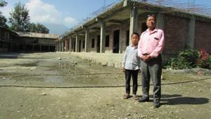Isaac Paulallungmuan Vaiphei, who will complete 11 years in November, with his father, Genkholian Vaiphei (65).(HT PHOTO) Isaac Paulallungmuan Vaiphei, who will complete 11 years in November, with his father, Genkholian Vaiphei (65).(HT PHOTO)
