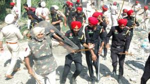 Police officers chase away protestors after stones were pelted on them while preparing the resumption of railway services, at Dhobi Ghat near Jaura Fatak in Amritsar on Sunday.(Sameer Sehgal / HT photo) Police officers chase away protestors after stones were pelted on them while preparing the resumption of railway services, at Dhobi Ghat near Jaura Fatak in Amritsar on Sunday.(Sameer Sehgal / HT photo)