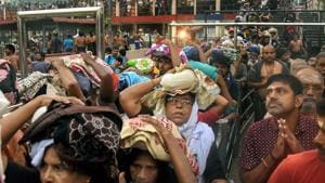 Devotees arrive to pay obeisance at Lord Ayyappa Temple in Sabarimala even as protesters keep women aged between 10 and 50 away despite the Supreme Court order.(PTI Photo) Devotees arrive to pay obeisance at Lord Ayyappa Temple in Sabarimala even as protesters keep women aged between 10 and 50 away despite the Supreme Court order.(PTI Photo)