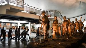 Students walk past a statue commemorating the Salt March of 1930, featuring Mahatma Gandhi and his followers, displayed inside the Rashtrapati Bhavan museum in New Delhi.(AFP) Students walk past a statue commemorating the Salt March of 1930, featuring Mahatma Gandhi and his followers, displayed inside the Rashtrapati Bhavan museum in New Delhi.(AFP)