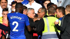 Manchester United manager Jose Mourinho is restrained by stewards after reacting to Chelsea's second goal.(REUTERS) Manchester United manager Jose Mourinho is restrained by stewards after reacting to Chelsea's second goal.(REUTERS)