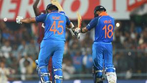 Indian batsman Rohit Sharma (L) celebrates with team captain Virat Kohli (R) after completing his century (100 runs) during the first one day international (ODI) cricket match between India and West Indies(AFP) Indian batsman Rohit Sharma (L) celebrates with team captain Virat Kohli (R) after completing his century (100 runs) during the first one day international (ODI) cricket match between India and West Indies(AFP)