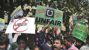 Drivers working for app-based taxis Uber and Ola protest outside Uber’s office in Mumbai on Monday.(AP) Drivers working for app-based taxis Uber and Ola protest outside Uber’s office in Mumbai on Monday.(AP)