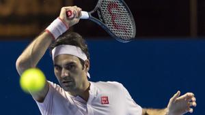 Roger Federer returns a ball to Filip Krajinovic during their first round match at the Swiss Indoors tennis tournament.(AP) Roger Federer returns a ball to Filip Krajinovic during their first round match at the Swiss Indoors tennis tournament.(AP)