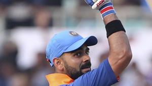 India's captain Virat Kohli raises his fist to celebrate scoring 10,000 runs in one-day internationals during the second one-day international cricket match between India and West Indies in Visakhapatnam.(AP) India's captain Virat Kohli raises his fist to celebrate scoring 10,000 runs in one-day internationals during the second one-day international cricket match between India and West Indies in Visakhapatnam.(AP)