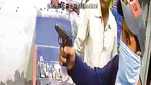 A video grab showing one of the robbers pointing gun at the money exchanger in Narinder Nagar locality of Ludhiana.(HT Photo) A video grab showing one of the robbers pointing gun at the money exchanger in Narinder Nagar locality of Ludhiana.(HT Photo)