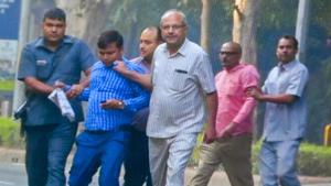 Security personnel detain two of the four men outside CBI’s Alok Verma’s residence.(PTI)