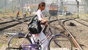 Barely a week after the Amritsar rail tragedy, a school girl is unmindful of the approaching train as she crosses the tracks in Jalandhar on Thursday.(HT Photo) Barely a week after the Amritsar rail tragedy, a school girl is unmindful of the approaching train as she crosses the tracks in Jalandhar on Thursday.(HT Photo)