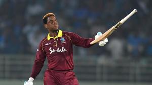 West Indies cricketer Shimron Hetmyer raises his bat after scoring a half century (50 runs) during the second one day international (ODI) cricket match between India and West Indies(AFP)