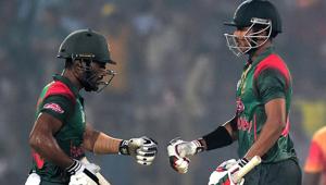 Bangladeshi cricketer Soumya Sarkar (R) celebrates with teammate Imrul Kayes (L) after hitting a boundary during the third one day international (ODI)(AFP) Bangladeshi cricketer Soumya Sarkar (R) celebrates with teammate Imrul Kayes (L) after hitting a boundary during the third one day international (ODI)(AFP)