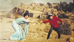 A scene from the film Guide. Rosie (Waheeda Rehman) breaks free and sings Aaj phir jeene ki tamanna hai, as Raju (Dev Anand) looks on.(HT Photo)