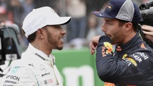 Red Bull driver Daniel Ricciardo (right) speaks to Lewis Hamilton after obtaining the first and third position respectively, during the qualifying session of the Formula One Mexico Grand Prix.(AP) Red Bull driver Daniel Ricciardo (right) speaks to Lewis Hamilton after obtaining the first and third position respectively, during the qualifying session of the Formula One Mexico Grand Prix.(AP)