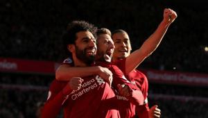 Mohamed Salah (left) celebrates after scoring Liverpool’s first goal with Adam Lallana and Virgil van Dijk.(Action Images via Reuters)