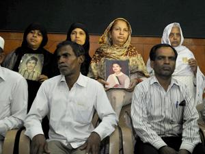 Relatives pose with photos of Hashimpura massacre victims in New Delhi.(HT file photo) Relatives pose with photos of Hashimpura massacre victims in New Delhi.(HT file photo)