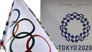 The Olympic flag and the logo of the Tokyo 2020 are displayed during the official flag arrival ceremony.(AFP/Getty Images)