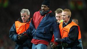 Stewards apprehend a pitch invader(REUTERS) Stewards apprehend a pitch invader(REUTERS)