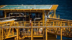 A worker passes a helicopter landing pad aboard an offshore oil platform in the Persian Gulf's Salman Oil Field, operated by the National Iranian Offshore Oil Co., near Lavan island, Iran.(Bloomberg) A worker passes a helicopter landing pad aboard an offshore oil platform in the Persian Gulf's Salman Oil Field, operated by the National Iranian Offshore Oil Co., near Lavan island, Iran.(Bloomberg)