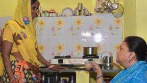 CM Vasundhara Raje sips tea at the house of a Ujjwala gas connection scheme beneficiary in Jhalawar, Friday, November 2, 2018.(HT Photo) CM Vasundhara Raje sips tea at the house of a Ujjwala gas connection scheme beneficiary in Jhalawar, Friday, November 2, 2018.(HT Photo)
