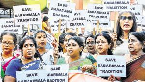 Lord Ayyappa devotees display placards during a protest rally against the Supreme Court order that allowed entry of women of all ages into the Sabrimala temple.(HT Photo)