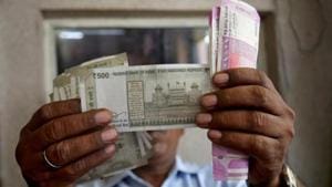 With global crude prices remaining elevated, the rupee is likely to be under pressure, and may touch the 76 levels against the US currency over the next three months, says a report.(Reuters File Photo) With global crude prices remaining elevated, the rupee is likely to be under pressure, and may touch the 76 levels against the US currency over the next three months, says a report.(Reuters File Photo)