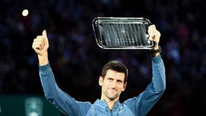 TOPSHOT - Second placed Serbia's Novak Djokovic poses with his trophy after the men's singles final tennis match against Russia's Karen Khachanov.(AFP) TOPSHOT - Second placed Serbia's Novak Djokovic poses with his trophy after the men's singles final tennis match against Russia's Karen Khachanov.(AFP)