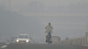 A cyclist rides through heavy haze, in New Delhi on Monday. According to the officials, pollution levels have sharply spiked today as a thick haze engulfed the national capital, ahead of Diwali, due to high impact of stubble burning that has pushed the air quality to the 'very poor' category.(PTI) A cyclist rides through heavy haze, in New Delhi on Monday. According to the officials, pollution levels have sharply spiked today as a thick haze engulfed the national capital, ahead of Diwali, due to high impact of stubble burning that has pushed the air quality to the 'very poor' category.(PTI)