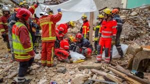 The two buildings, one condemned as substandard and seemingly empty, the other containing apartments, collapsed on Monday.(AFP) The two buildings, one condemned as substandard and seemingly empty, the other containing apartments, collapsed on Monday.(AFP)