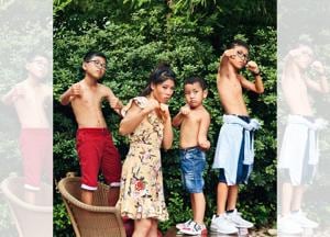 Mary Kom bonding with her kids Rengpa, Prince and Nainai. Location courtesy: Taj Mahal Hotel, New Delhi; Art direction: Amit Malik; Make-up and hair: Artistry by Anjali Jain. On Mary: Dress, Forever New. On Rengpa (left): Shirt and shorts,UCB; shoes, Nike. On Prince (centre): T-shirt and shorts, UCB; shoes bought from Vietnam. On Nainai (right): Shirt, UCB; shorts, Zara Kids; shoes, Nike(Prabhat Shetty) Mary Kom bonding with her kids Rengpa, Prince and Nainai. Location courtesy: Taj Mahal Hotel, New Delhi; Art direction: Amit Malik; Make-up and hair: Artistry by Anjali Jain. On Mary: Dress, Forever New. On Rengpa (left): Shirt and shorts,UCB; shoes, Nike. On Prince (centre): T-shirt and shorts, UCB; shoes bought from Vietnam. On Nainai (right): Shirt, UCB; shorts, Zara Kids; shoes, Nike(Prabhat Shetty)