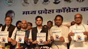 MP congress president Kamal Nath along with campaign committee chief Jyotiraditya Scindia and former chief minister Digvijaya Singh, among others, releasing party election manifesto MP congress president Kamal Nath along with campaign committee chief Jyotiraditya Scindia and former chief minister Digvijaya Singh, among others, releasing party election manifesto