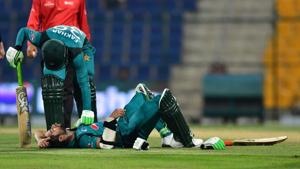 Pakistan cricketer Fakhar Zaman checks his teammate Pakistan cricketer Imam Ul-Haq as he lies on the pitch after being hit by a ball during the second one day international (ODI) cricket match between Pakistan and New Zealand(AFP) Pakistan cricketer Fakhar Zaman checks his teammate Pakistan cricketer Imam Ul-Haq as he lies on the pitch after being hit by a ball during the second one day international (ODI) cricket match between Pakistan and New Zealand(AFP)