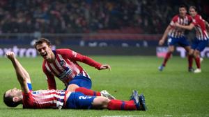 Atletico Madrid's Uruguayan defender Diego Godin (L) celebrates with Atletico Madrid's French forward Antoine Griezmann after scoring a goal during the Spanish league football match between Club Atletico de Madrid and Athletic Club Bilbao(AFP) Atletico Madrid's Uruguayan defender Diego Godin (L) celebrates with Atletico Madrid's French forward Antoine Griezmann after scoring a goal during the Spanish league football match between Club Atletico de Madrid and Athletic Club Bilbao(AFP)