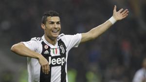 Juventus' Cristiano Ronaldo celebrates after he scored his side's second goal during a Serie A soccer match between AC Milan and Juventus, at Milan's San Siro stadium(AP) Juventus' Cristiano Ronaldo celebrates after he scored his side's second goal during a Serie A soccer match between AC Milan and Juventus, at Milan's San Siro stadium(AP)