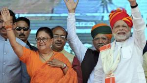 Prime Minister Narendra Modi and Rajasthan chief minister Vasundhara Raje greet their supporters during 'Vijay Sankalp Sabha', in Ajmer on October 6.(PTI Photo) Prime Minister Narendra Modi and Rajasthan chief minister Vasundhara Raje greet their supporters during 'Vijay Sankalp Sabha', in Ajmer on October 6.(PTI Photo)