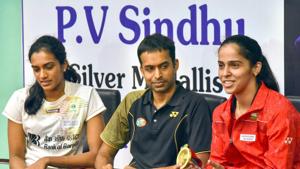 File image: Indian badminton coach P Gopichand flanked by PV Sindhu andSaina Nehwal during a press conference.(PTI) File image: Indian badminton coach P Gopichand flanked by PV Sindhu andSaina Nehwal during a press conference.(PTI)
