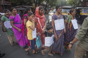 Residents of Mahul village form a human chain to protest against the government with a demand to shift them to a better place.(Pratik Chorge/HT Photo) Residents of Mahul village form a human chain to protest against the government with a demand to shift them to a better place.(Pratik Chorge/HT Photo)