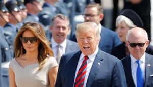US President Donald Trump (C) and US first lady Melania Trump (L).(AFP) US President Donald Trump (C) and US first lady Melania Trump (L).(AFP)