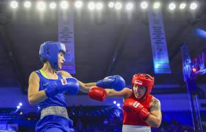 New Delhi: Stanimira Petrova (Blue) of Bulgaria fights with Rianna Rios of USA in womens' 57 kg category bout during AIBA Women's World Boxing Championships at IG Stadium in New Delhi, Saturday, Nov. 17, 2018(PTI) New Delhi: Stanimira Petrova (Blue) of Bulgaria fights with Rianna Rios of USA in womens' 57 kg category bout during AIBA Women's World Boxing Championships at IG Stadium in New Delhi, Saturday, Nov. 17, 2018(PTI)