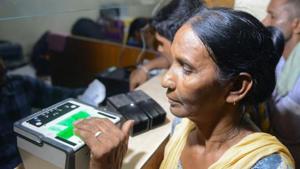 This photo taken on July 17, 2018 shows an Indian woman getting her fingerprints read during the registration process for Aadhaar cards(AFP file photo for representation) This photo taken on July 17, 2018 shows an Indian woman getting her fingerprints read during the registration process for Aadhaar cards(AFP file photo for representation)