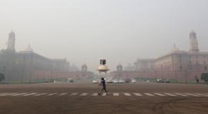 A man crosses a road next to defence ministry and home ministry buildings in New Delhi.(REUTERS) A man crosses a road next to defence ministry and home ministry buildings in New Delhi.(REUTERS)