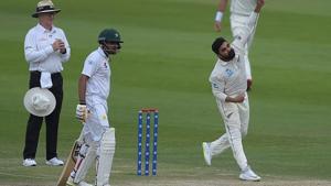 New Zealand spinner Ajaz Patel (R) delivers the ball as Pakistani batsman Babar Azam looks on during the second day of the first Test cricket match between Pakistan and New Zealand at the Sheikh Zayed International Cricket Stadium in Abu Dhabi.(AFP/Getty Images) New Zealand spinner Ajaz Patel (R) delivers the ball as Pakistani batsman Babar Azam looks on during the second day of the first Test cricket match between Pakistan and New Zealand at the Sheikh Zayed International Cricket Stadium in Abu Dhabi.(AFP/Getty Images)