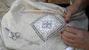 A woman stitches famous Lefkaritiko lace in Lefkara village, Cyprus.(AP Photo/Petros Karadjias) A woman stitches famous Lefkaritiko lace in Lefkara village, Cyprus.(AP Photo/Petros Karadjias)