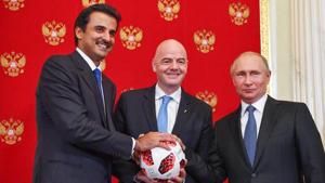 (From left) Emir of Qatar Sheikh Tamim bin Hamad Al-Thani, FIFA president Gianni Infantino and Russian president Vladimir Putin pose for a photography during a symbolic transfer of the authority to Qatar to host the World Cup 2022.(AFP) (From left) Emir of Qatar Sheikh Tamim bin Hamad Al-Thani, FIFA president Gianni Infantino and Russian president Vladimir Putin pose for a photography during a symbolic transfer of the authority to Qatar to host the World Cup 2022.(AFP)