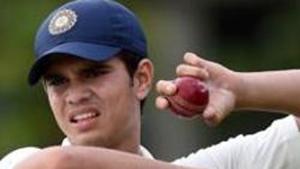 IArjun Tendulkar, son of the Indian former cricket superstar Sachin Tendulkar, holds a ball during a practice session.(AFP) IArjun Tendulkar, son of the Indian former cricket superstar Sachin Tendulkar, holds a ball during a practice session.(AFP)