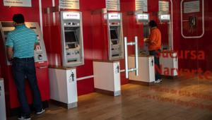 Nearly 50% ATMs may be shut down by March 2019 due to unviability of operations, hitting hard both urban and rural population, the Confederation of ATM Industry (CATMi) warned on Wednesday.(Bloomberg/Picture for representation) Nearly 50% ATMs may be shut down by March 2019 due to unviability of operations, hitting hard both urban and rural population, the Confederation of ATM Industry (CATMi) warned on Wednesday.(Bloomberg/Picture for representation)