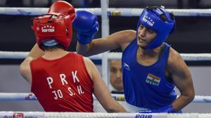 Sonia Chahal (in blue) punches her North Korean opponent Jo Son Hwa during their semifinal match.(PTI) Sonia Chahal (in blue) punches her North Korean opponent Jo Son Hwa during their semifinal match.(PTI)