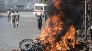 A bike is burnt in Mumbai in January 2018 after the Bhima-Koregaon violence.(HT FILE)