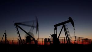 Oil pumps are seen after sunset outside Vaudoy-en-Brie, near Paris. Oil prices fell to their lowest in more than a year on Friday, on course for their biggest one-month decline since late 2014, even as oil producers considered cutting production to try to stem a rising global surplus.(Reuters File Photo) Oil pumps are seen after sunset outside Vaudoy-en-Brie, near Paris. Oil prices fell to their lowest in more than a year on Friday, on course for their biggest one-month decline since late 2014, even as oil producers considered cutting production to try to stem a rising global surplus.(Reuters File Photo)