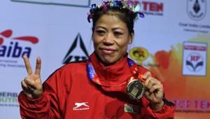 Mary Kom of India gestures with her gold medal after winning the 45-48 kg category final fight at the 2018 AIBA Women's World Boxing Championships in New Delhi on November 24, 2018. (Photo by Sajjad HUSSAIN / AFP)(AFP) Mary Kom of India gestures with her gold medal after winning the 45-48 kg category final fight at the 2018 AIBA Women's World Boxing Championships in New Delhi on November 24, 2018. (Photo by Sajjad HUSSAIN / AFP)(AFP)