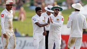 Sri Lanka's Lakshan Sandakan (2nd L) celebrates with his teammates after taking the wicket of England's Ben Stokes.(REUTERS) Sri Lanka's Lakshan Sandakan (2nd L) celebrates with his teammates after taking the wicket of England's Ben Stokes.(REUTERS)